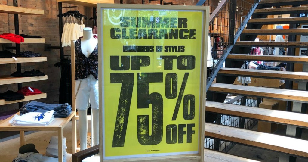clearance sing in clothing store by stairs