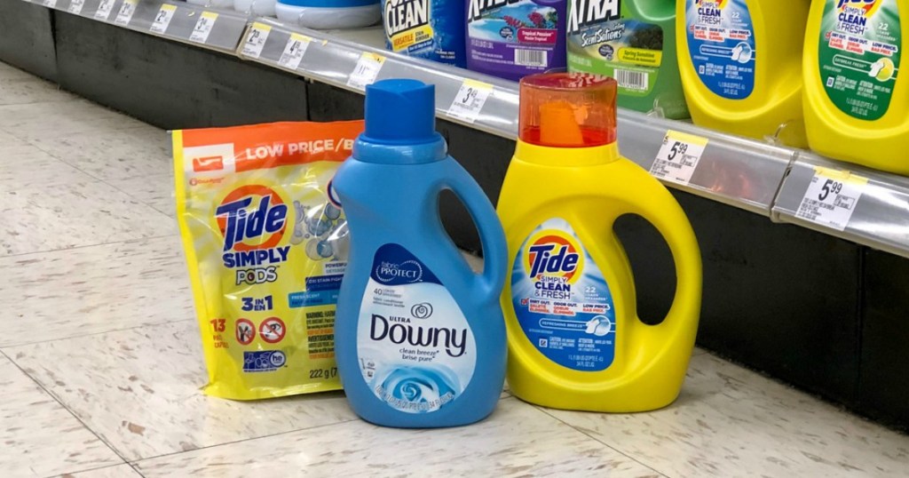 tide simply laundry detergent and downy fabric softener on floor at walgreens