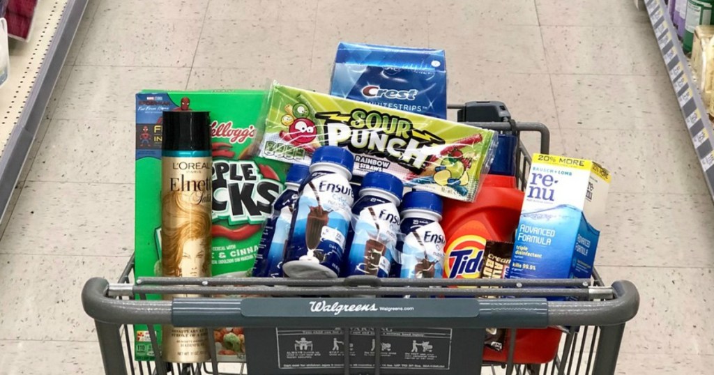 kellogg's apple jacks cereal, l'oreal elnett hairspray, ensure nutrition shakes, tide laundry detergent, crest whitestrips, sour punch candy and renu contact lens solution in shopping cart at walgreens