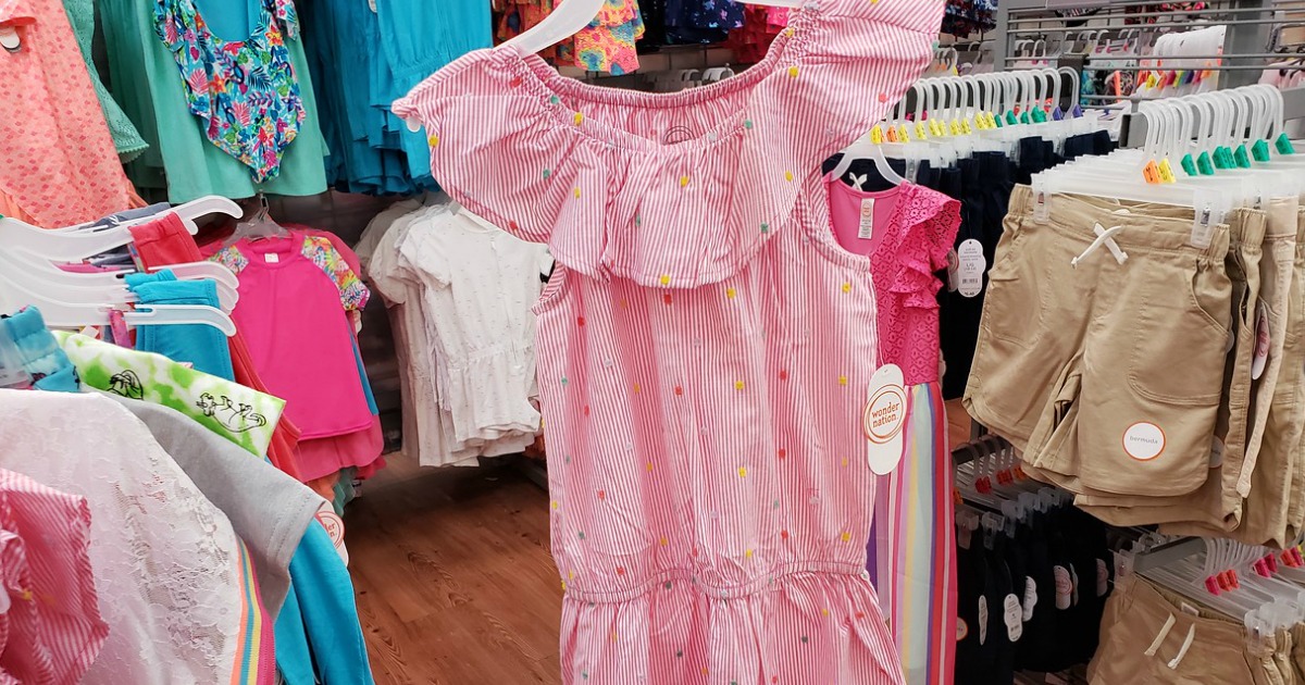 girls pink dress with ruffles in store