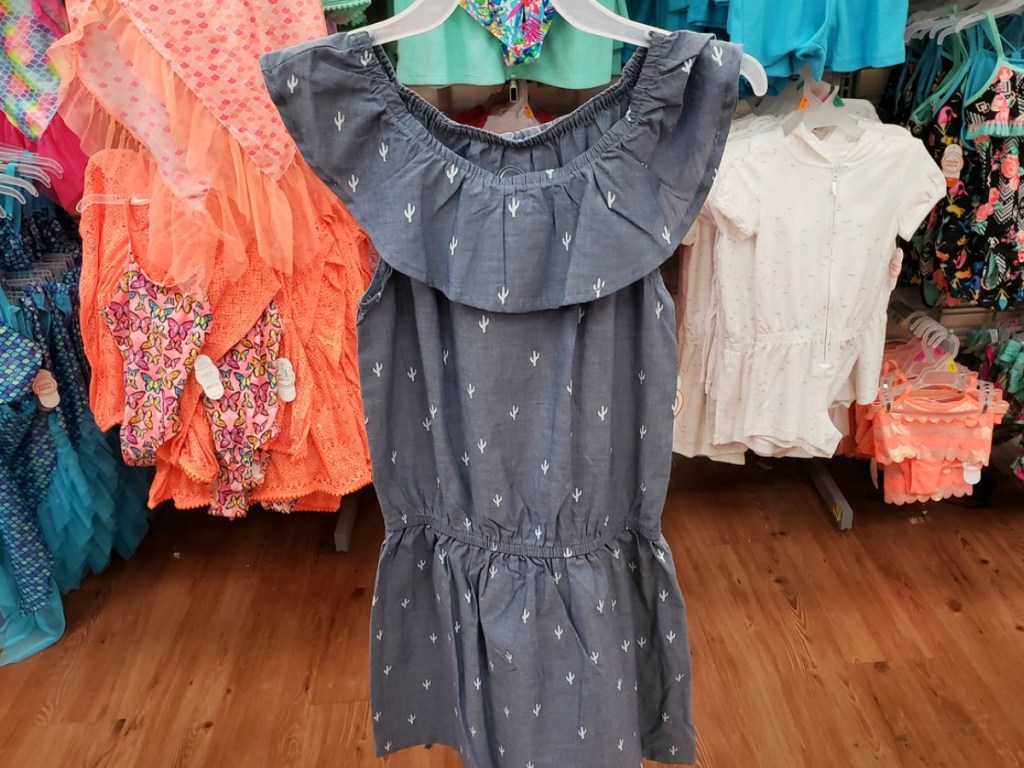 dress with ruffles in grey at store