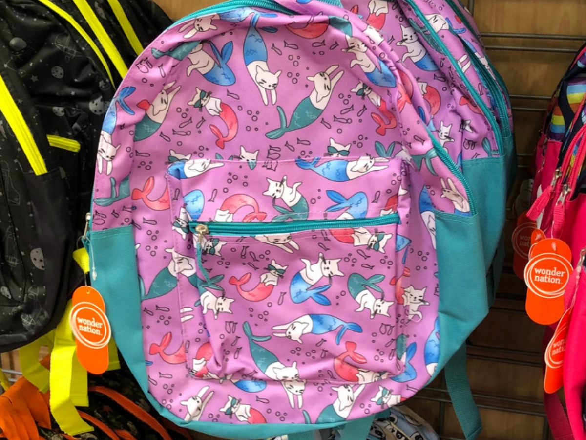 store display with pink and blue backpack