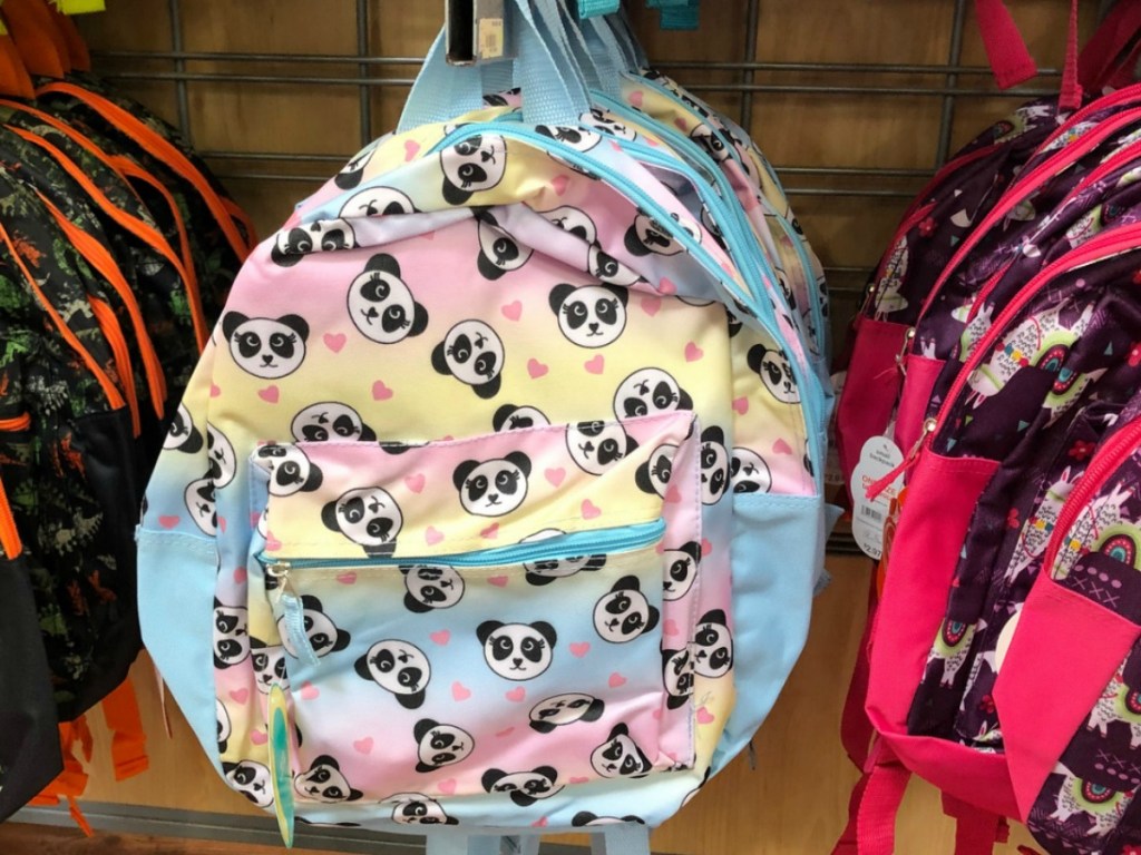 store display with backpack with panda faces on it