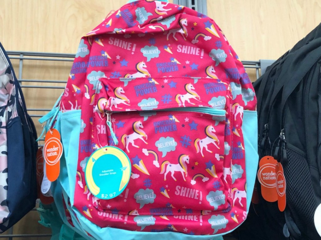 store display with pink and blue backpack with unicorns