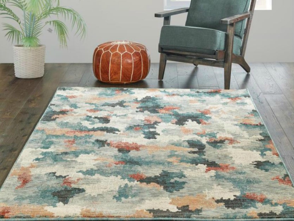 woven multi-colored rug on wood floor