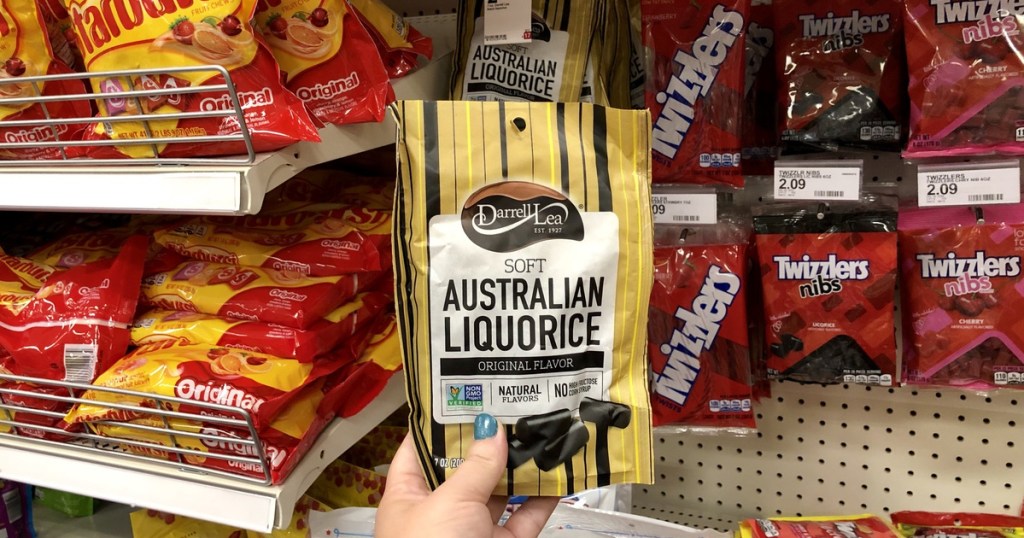 woman holding bag of liquorice at target