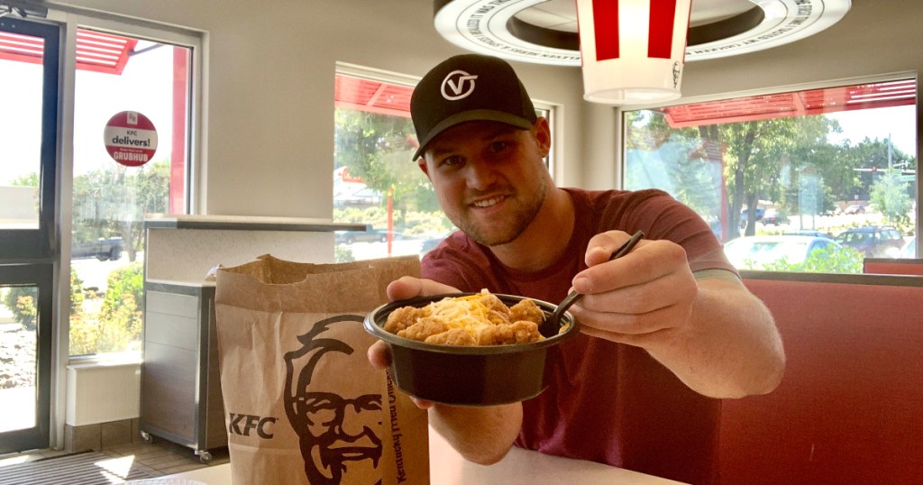 man holding KFC Mac and Cheese Bowl