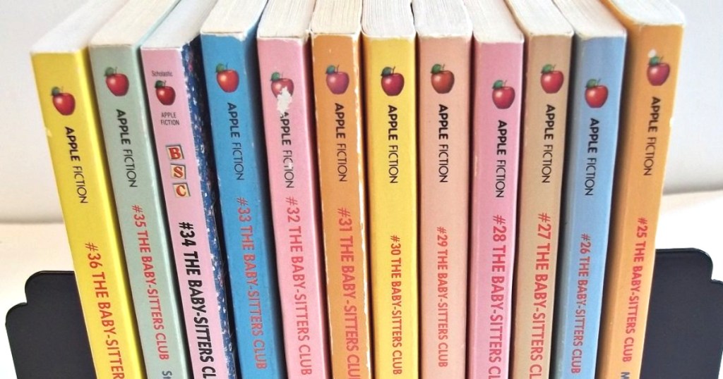 stack of baby sitters club books in book holder