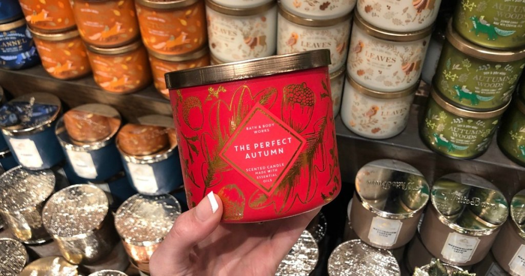 woman holding Bath & Body Works The Perfect Autumn Candle(1)
