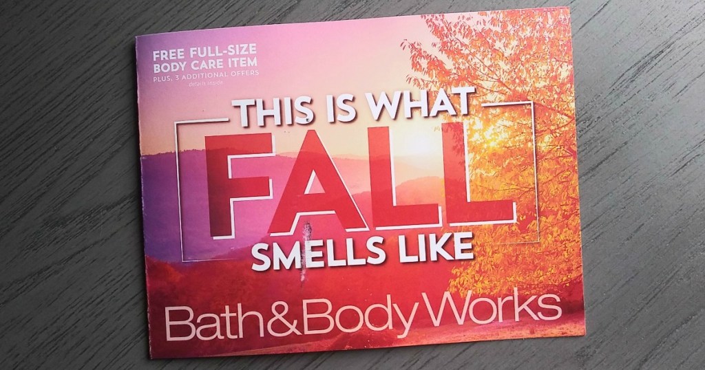 Bath & Body Works coupon mailer on gray wooden desk