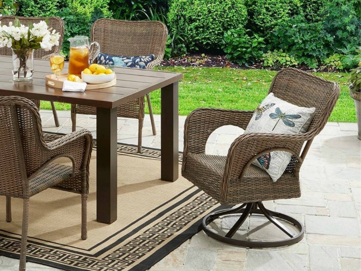 Better Homes & Gardens Wicker Swivel Chair at head of patio table