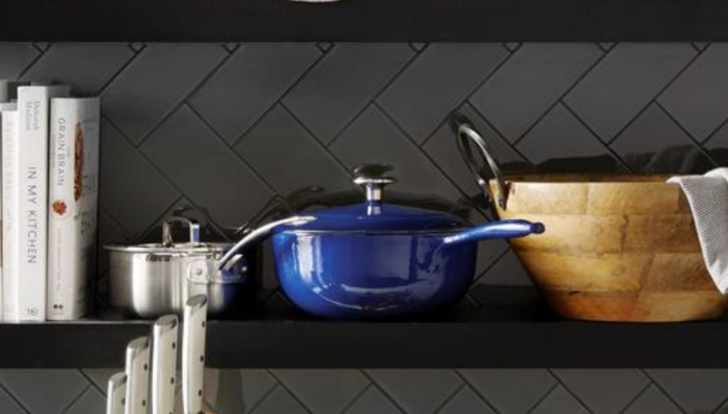Cobalt Blue cast-iron enameled skillet on shelf near other cookware 
