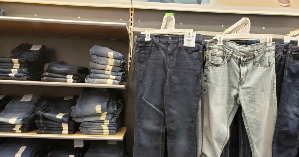 kids jeans folded on shelved and haning in-store