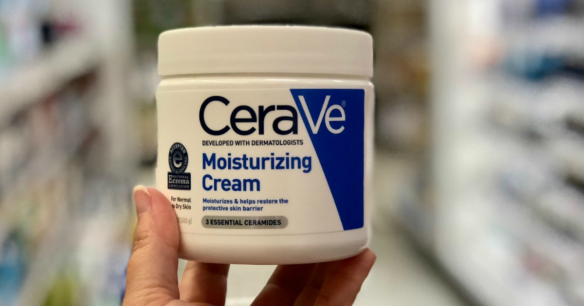 Jar of CeraVe Moisturizing Cream in hand in store