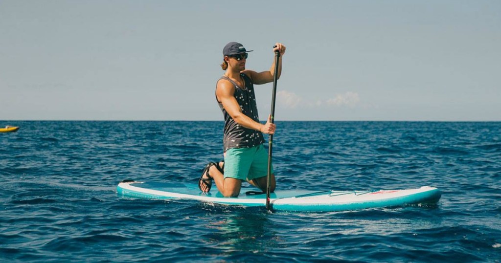 man on paddleboard in the ocean