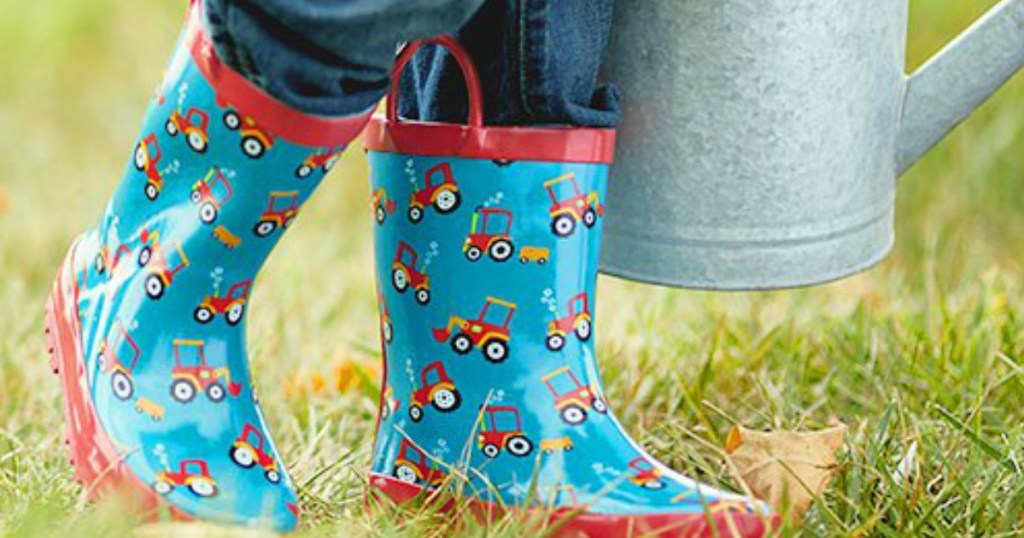 rain boots by watering can