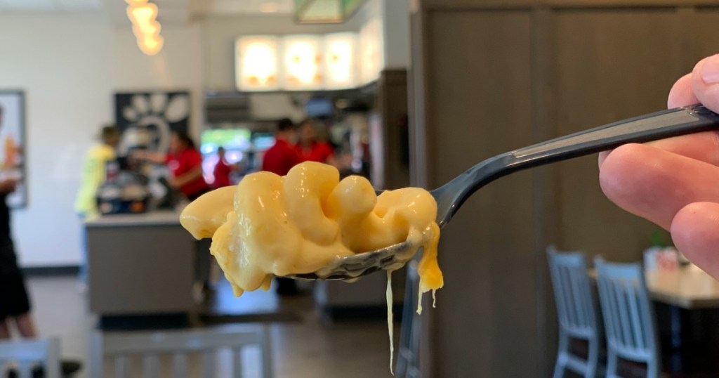 Person holding spoonful of Chick-fil-a mac & cheese