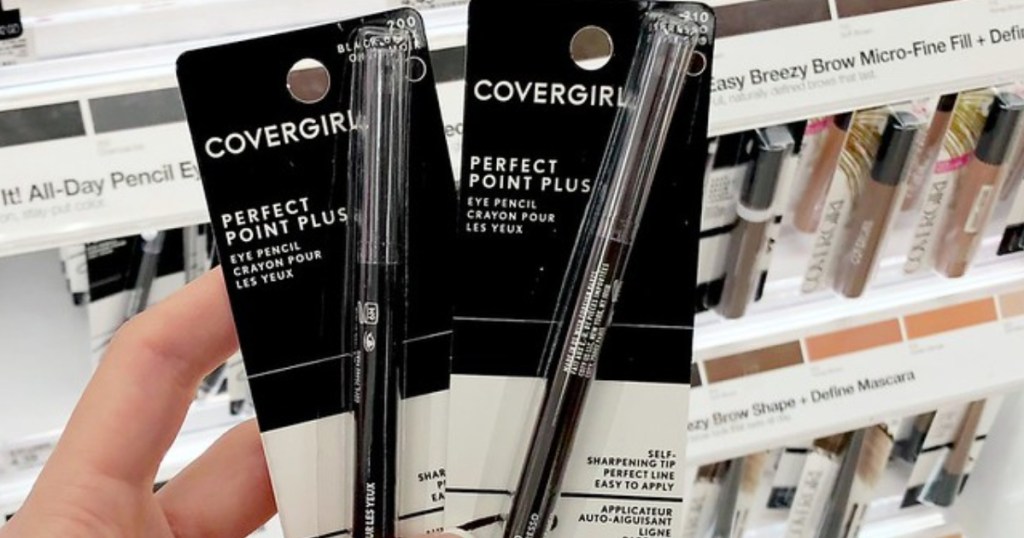 woman holding 2 covergirl eyeliners