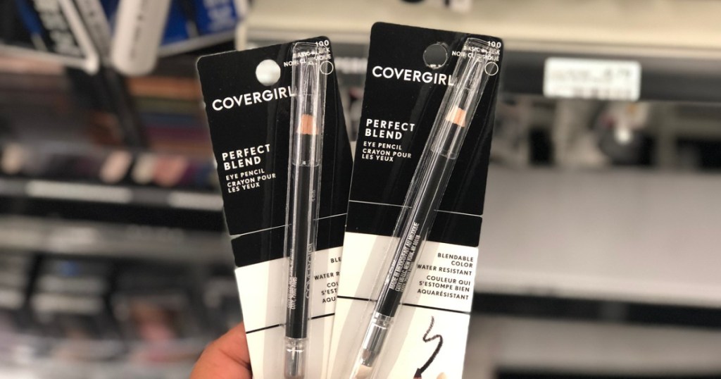 woman holding 2 covergirl eyeliners