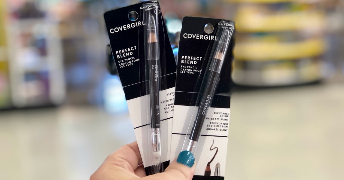 hand holding CoverGirl eyeliners