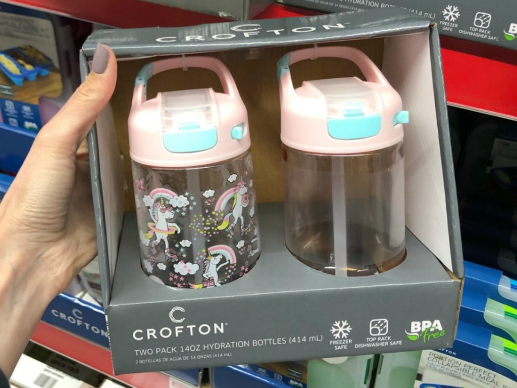 hand holding box with 2 kids water bottles in store