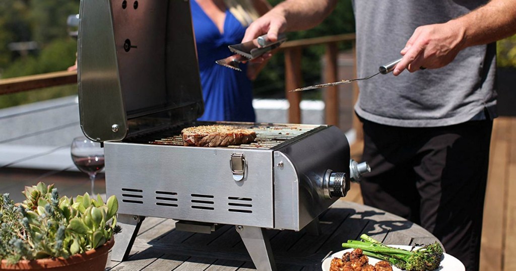 man grilling on a tabletop grill