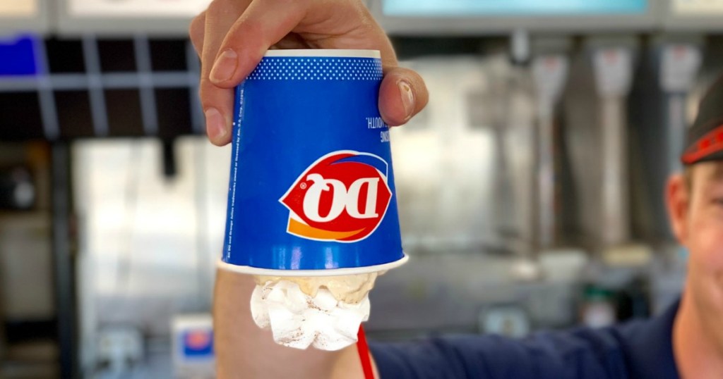 dq employee holding blizzard upside down