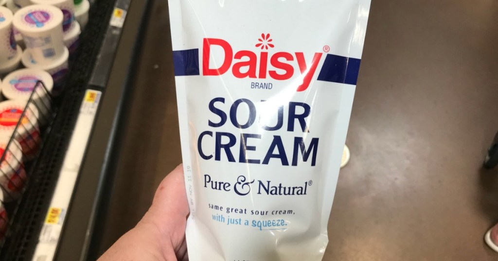 hand holding Daisy Sour Cream