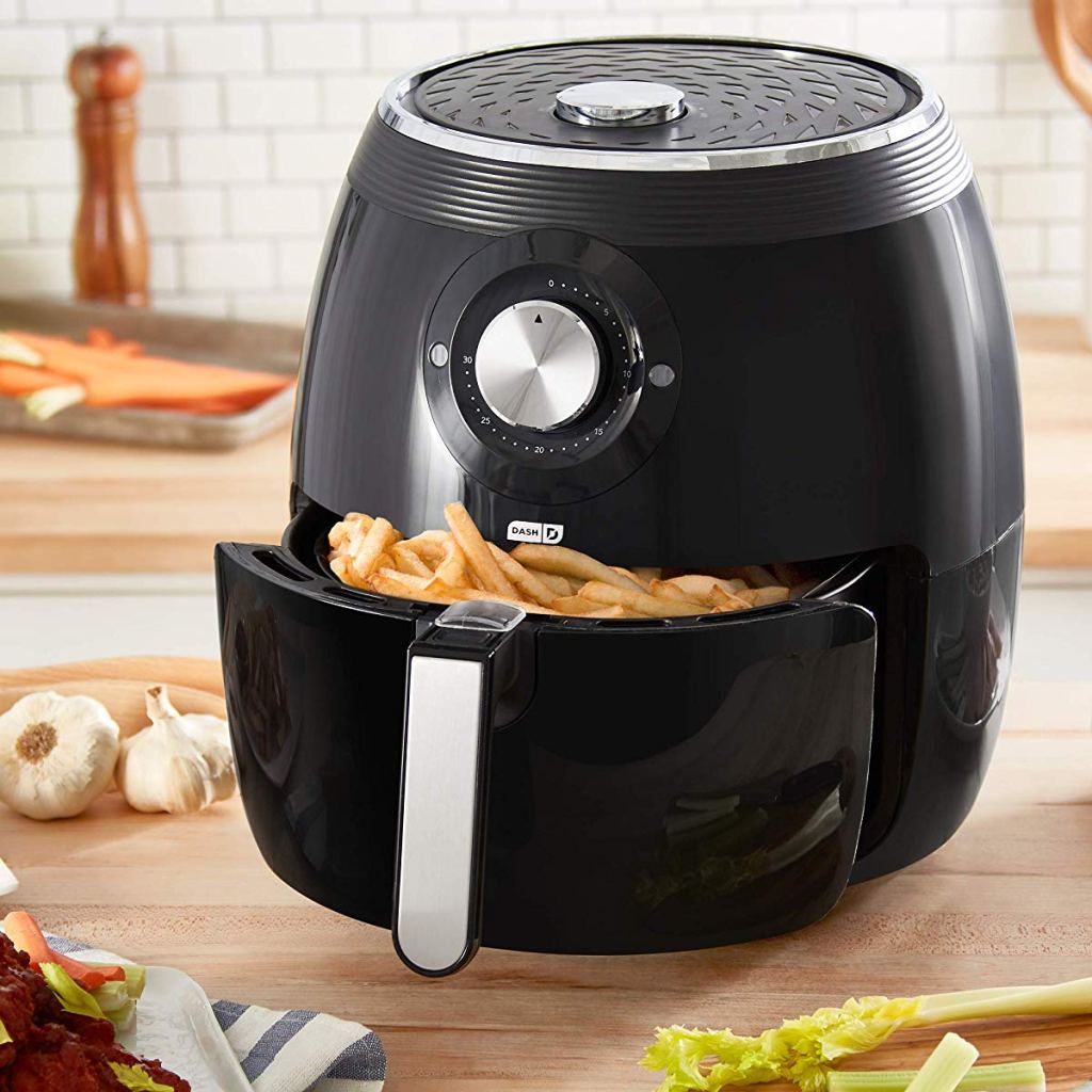 air fryer on kitchen counter with fries in the basket