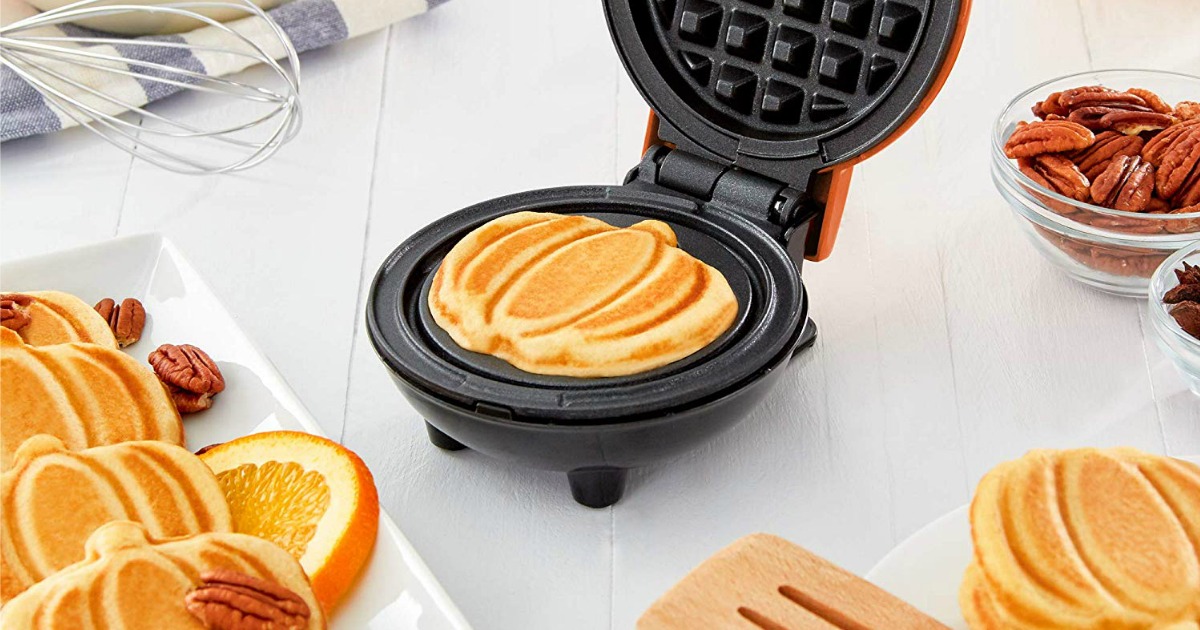 Dash Mini Pumpkin Waffle Maker on kitchen counter with pumpkin shaped waffles