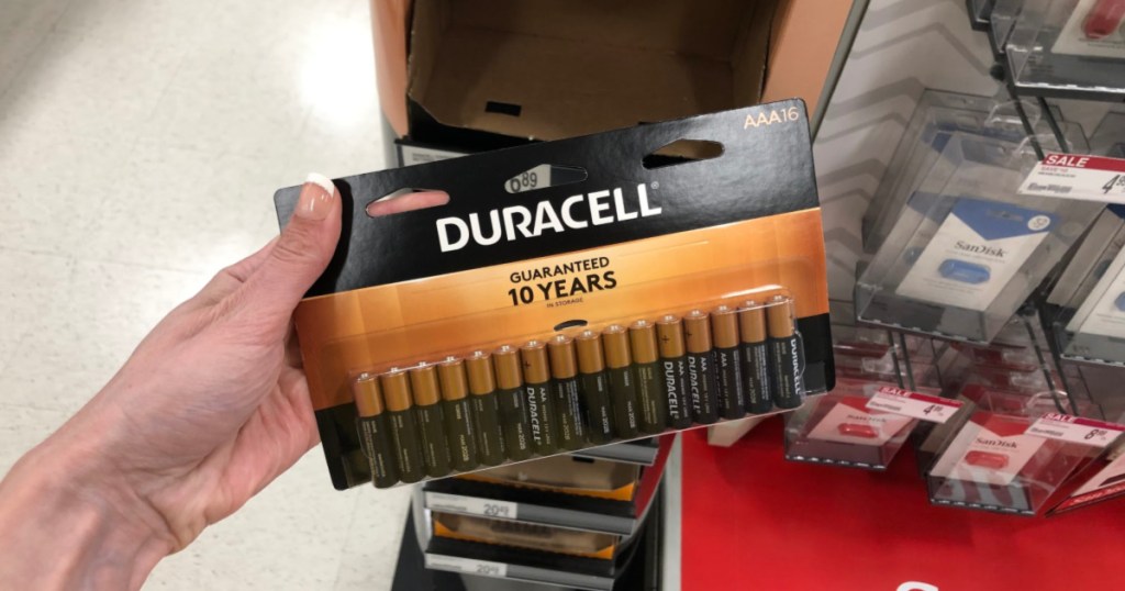 hand holding duracell aaa batteries