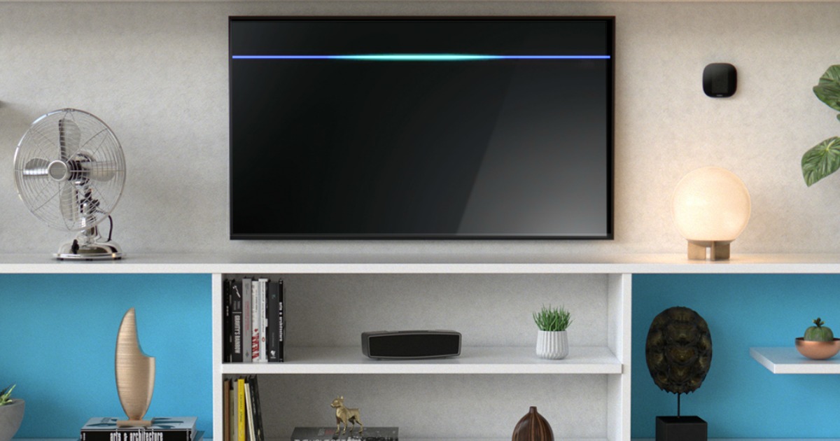 Fire TV Recast on entertainment stand under tv