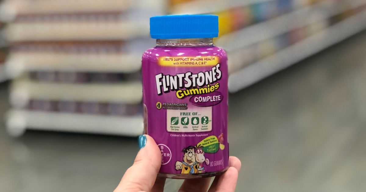 hand holding Flintstones Gummies Complete