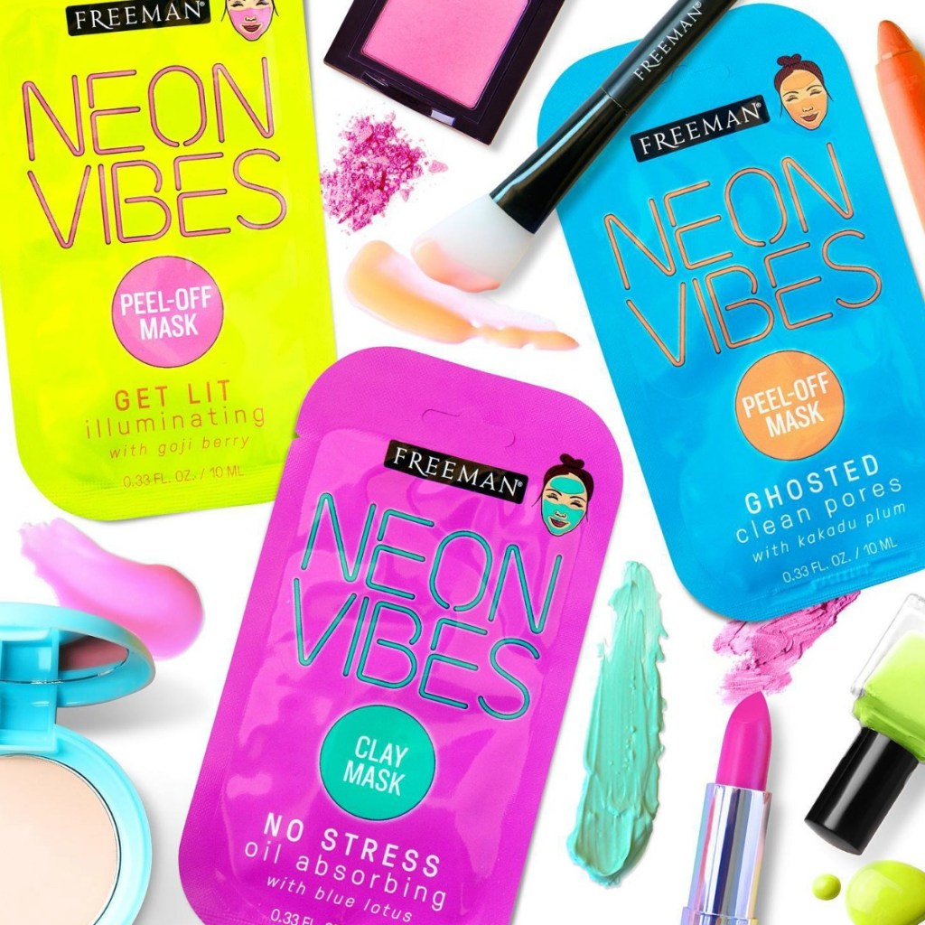 Freeman Beauty neon colored facial masks with neon colored beauty products and makeup