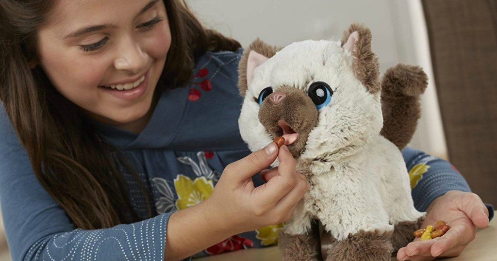 girl playing with a FurReal Friends kitten