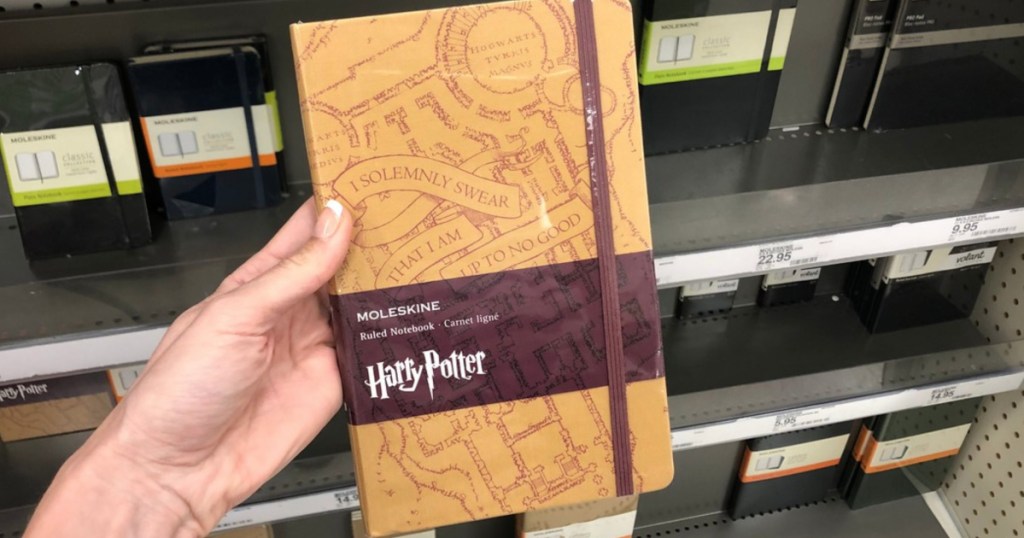 Hand holding Harry Potter Moleskin Notebook at Target 