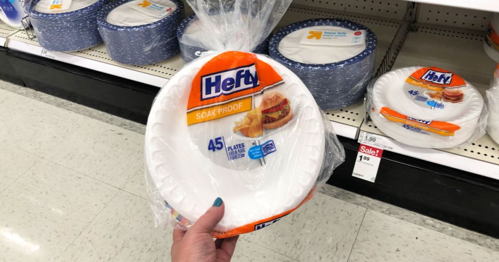 Hand holding hefty plates at target