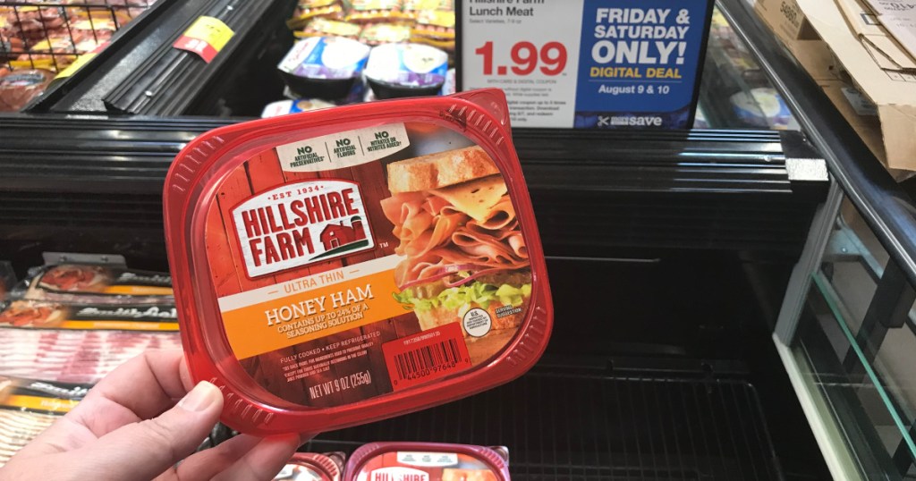woman holding pack of hillshire lunch meat at target