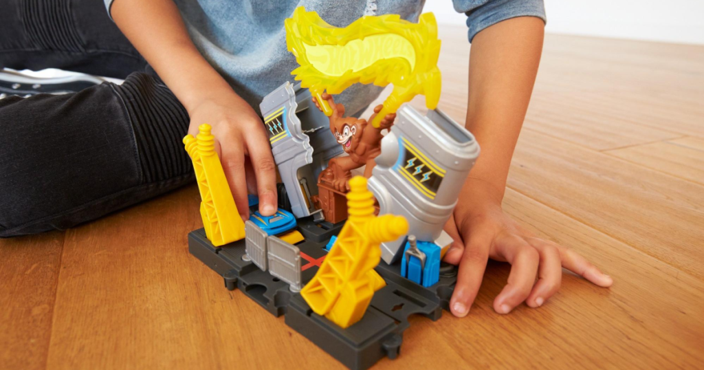 Hot Wheels City Downtown Power Plant Blast Playset with child playing with it on floor
