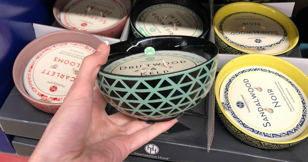 Huntington Home bowl candle being held in hand at ALDI store in front of shelf