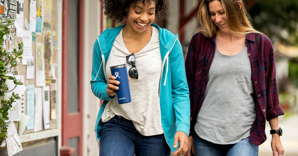 Women walking and holding Hydro Flask Tumbler