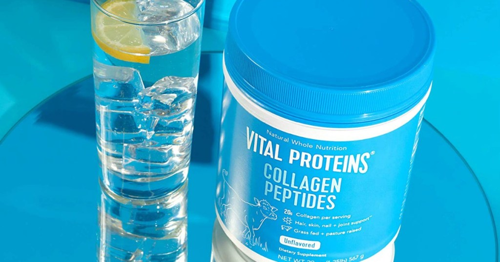 collagen peptides jar with a glass of water