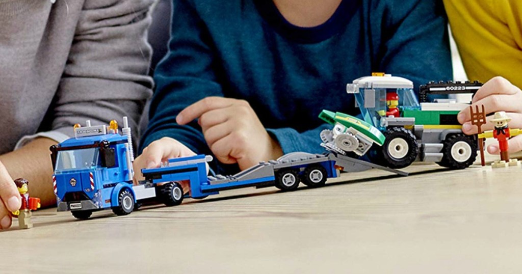 kids playing with LEGO City great vehicles harvester transport set