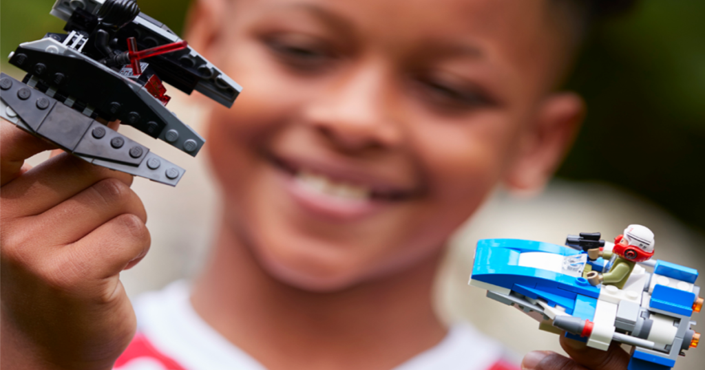 LEGO Star Wars The Last Jedi A-Wing vs. TIE Silencer Microfighters Building Kit in kids hands
