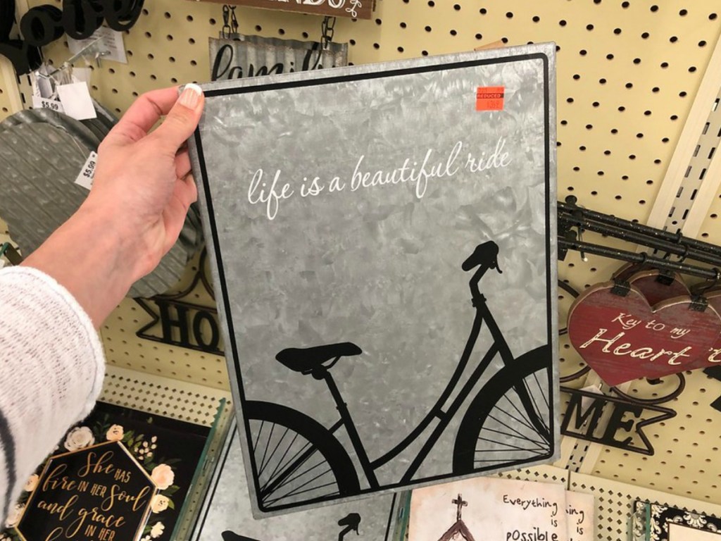 lady holding 'Life is a Beautiful Ride sign' at Hobby Lobby