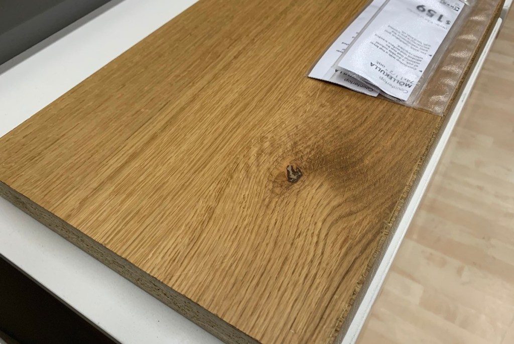 oak countertop laying on white counter with price tag