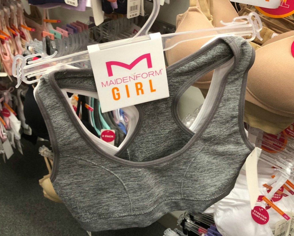 Gray and white girls sports bras from Kohl's on hanger in store