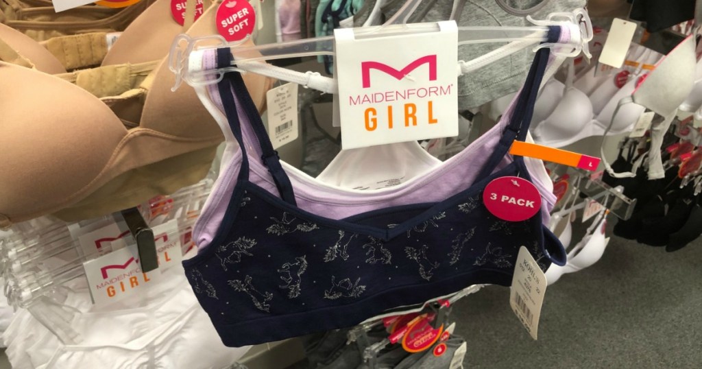 Three pack of Maidenform brand girls bras on hanger in-hand at store