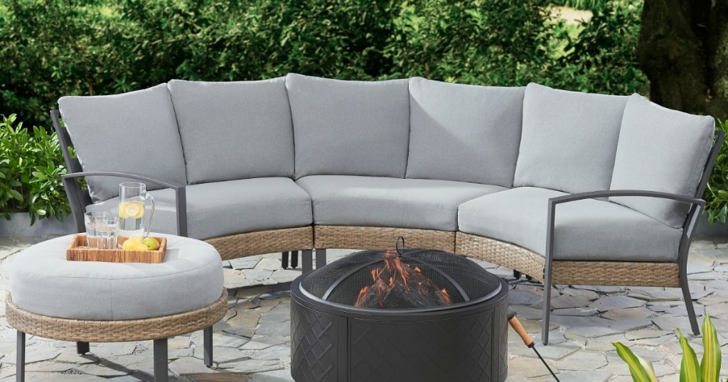 4-piece outdoor half-round patio sectional with ottoman near a firepit