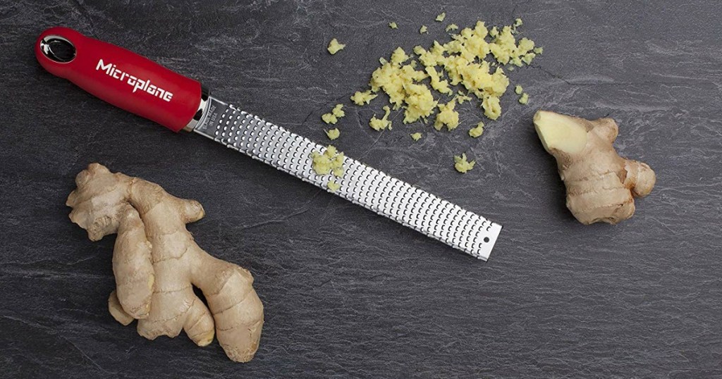 zester shown next to ginger and freshly grated ginger